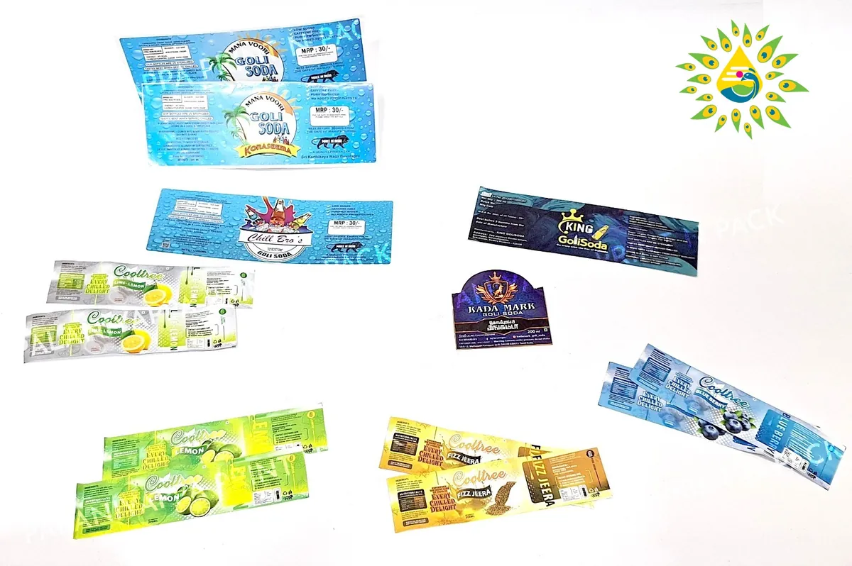 Colourful printed beverage labels arranged together.