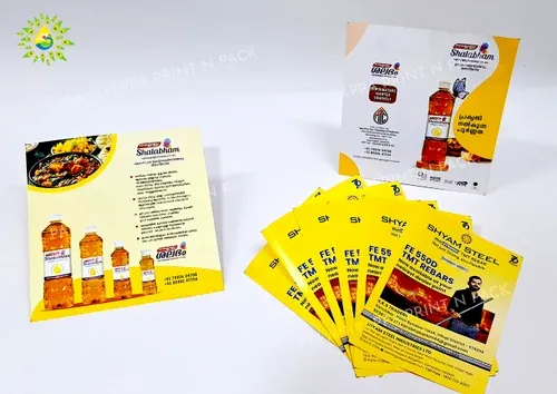 Printed leaflets fanned beside a folded brochure
