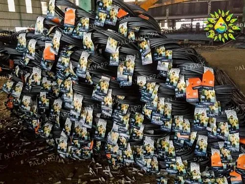 A warehouse heap of steel bar coils with a white and blue tag on every coil
