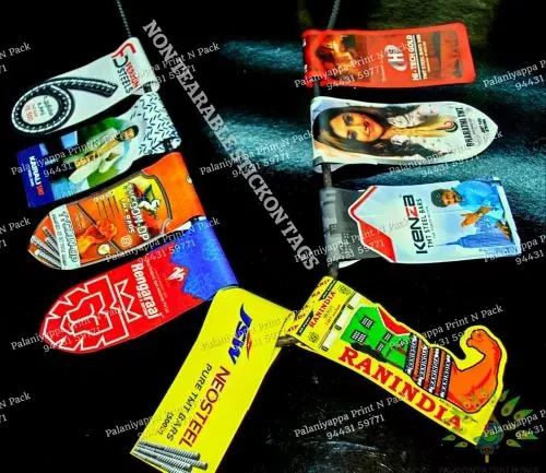 Die-cut stick-on tags scattered on black