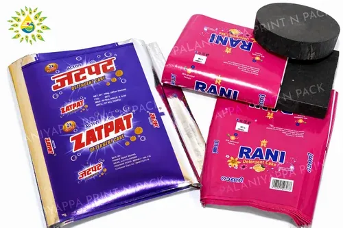 Printed detergent cake wrappers and a wrapped cake