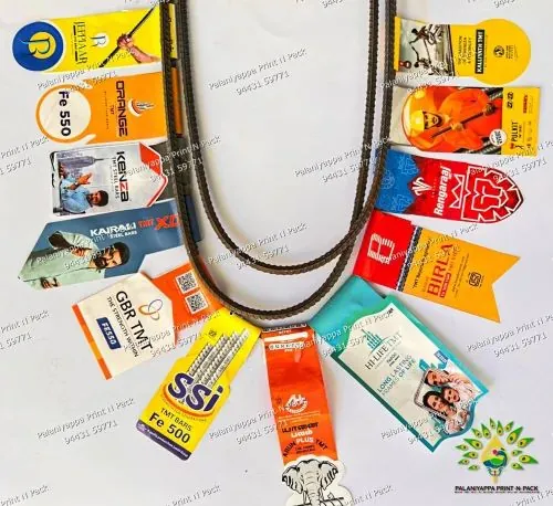 Printed tags fanned in a U around a bent steel bar, on white