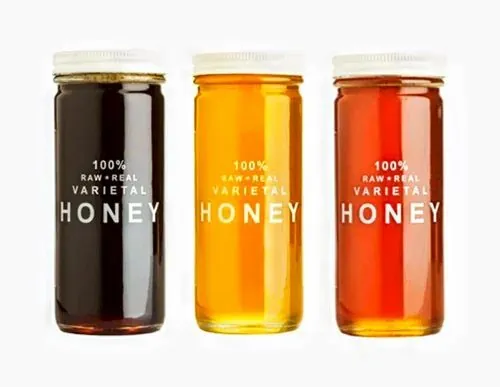 Three honey jars with transparent printed labels