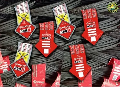 Red arrow-shaped stick-on tags lying on a stack of steel bars