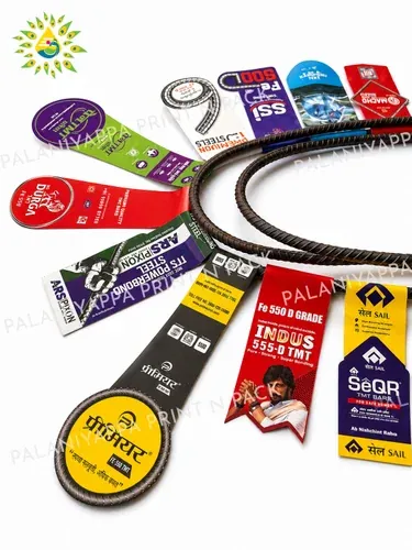 Printed tags fanned outward around a ring of steel bar, on white